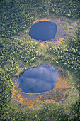 Two small lakes in forest area, aerial view. Lappland.Sweden