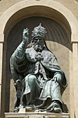 Statue of Pope Gregory XIII dressed it up as Saint Petronius on the façade of Palazzo dAccursio (aka Palazzo Comunale, Town Hall), Bologna. Emilia-Romagna, Italy