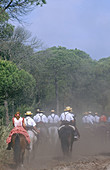 Pilgrims on horseback in Doñana National Park to El Rocío. Huelva province, Andalusia, Spain