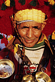 Moroccan man wearing costume with ornate head-dress. Marrakech. Morocco