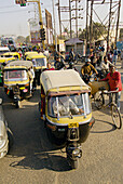 Congested street scene with motorcycle rickshaws (tuk tuks), Agra, Uttar Pradesh, India