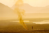 Smoke from a fire at sunrise, Jaipur, Rajasthan, India