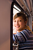 Young woman, girl looking out of a train, Travel, Mittenwald, Upper Bavaria, Bavaria, Germany