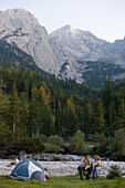 Couple camping in the mountains, Upper Bavaria, Bavaria, Germany