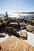 Man looking out to sea at Cape Point, Cape of Good Hope, Cape Peninsula, Western Cape, South Africa