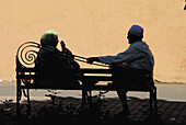 Couple on a bank. Marrakech, Morocco.