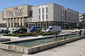 Children having a bath in a fountain. National Museum of History, Tirana, Albania