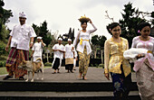 Family leaving a Temple Ceremony. Besakih. Bali. Indonesia