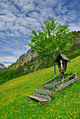 Pasture with bench and cross, Lofer, Berchtesgaden Alps, Salzburg (state), Austria