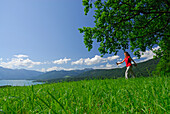 Woman nordic walking, lake Tegernsee, Bavarian foothills, Upper Bavaria, Bavaria, Germany