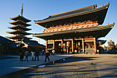 People in front of Hozomon Gate and five storied Pagoda, Asakusa, Tokyo, Japan, Asia
