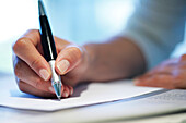 Close up of a hand holding a pen, Writing, Business