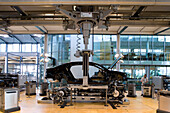 The transparent factory, automobile production plant owned by Volkswagen, modern factory designed to make the production line visible to the outside world. The luxury Phaeton automobile is built here. Preparation of the wedding, where the bodywork is scre
