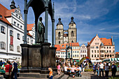 Market place with Luther and Melanchthons monuments, town hall and St. Mary's church, Lutherstadt Wittenberg, Saxony Anhalt, Germany