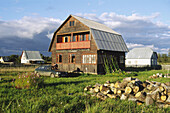 Wooden cottage and firewood, Moscow region, Russia.