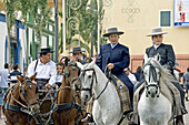 Horsemen in El Real de la Feria. Fuengirola. Málaga province, Costa del Sol. Andalusia, Spain