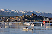 San Vicente de la Barquera and Picos de Europa view from Playa del Tostadero. Cantabria. Spain.