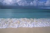 Beach, surf and tropical sky. Bird Island, Seychelles