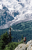 Backpacker and Mt. Rainier. Mt. Rainier National Park. Washington. USA.