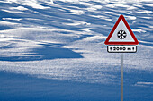 Snow and danger sign.