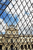 Louvre Museum façade as seen from the inside of the pyramid. Paris. France.