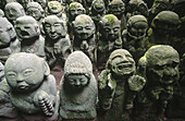 Small concrete figures covered with moss at Atago Nembutsu-ji, in Sagano. Kyoto city. Kyoto. Japan.