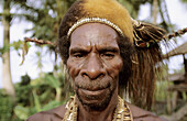 Portrait of an Asmat man with head-dress, Western Papuasia, Former Irian-Jaya, Indonesia