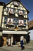 Half-timbered house decorated with teddy bears cloths, Obernai, Alsace, France