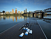 Portlands waterfront with oars on a dock and the Hawthorne Bridge.