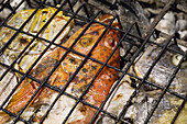 Tropical fish grilling on barbecue, close-up. Indonesia