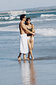 couple sightseeing on beach