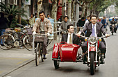 General manager of the Ritz Carlton of Shaghai rides on a vintage motos scooter in Shanghai. China.