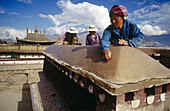 Tibetan woman rebuilds an old Buddhist monastery in Lhasa. Tibet. China.