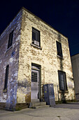 Decrepit paint factory at night