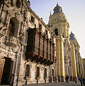 Cathedral and archbishop palace with colonial balcony. Plaza de Armas. Lima. Peru.