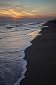 Sunset in winter on the beach.