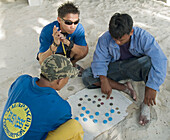playing chinese checkers on the beach, Malapascua Island, Philippines