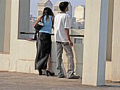A young couple standing on a Terrace of the call center building. Pune, Maharashtra, India.