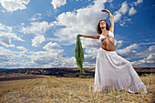 ucasians, Cloud, Clouds, Color, Colour, Contemporary, Curly hair, Daytime, Deserted, Exterior, Female, Field, Fields, Full-body, Full-length, Human, Long hair, Long haired, Long-haired, Nature, One, O