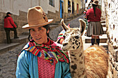 Indian woman  with LLama and Child, Cuzco, Peru