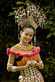 Iban lady wearing traditional costume at Sarawak Cultural Village, Damai, Sarawak, Malaysia.