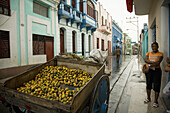 Selling lemons in Heredia street after the rain. Santiago de Cuba. Cuba.