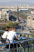 Tourists at café terrace, Barcelona, Spain