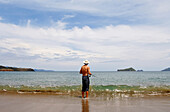 Man fishing on the beach near San Juan del Sur, Nicaragua, Central America