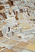 Inca man in the salt pans of Salinas, Valle Sagrado de los Inca, Sacred Valley, Peru, South America