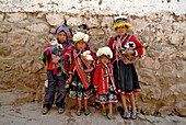 Inca children carrying pets in Pisac, Peru, South America