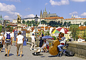 Musicians on Charles Bridge and Prague Castle in Prague, Czech Republic