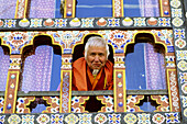 Old man in a typical window. Paro. Bhutan.