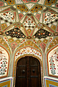 Interior, painted wall. Amber Fort. Jaipur. Rajasthan. India.