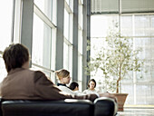 Businesspeople sitting in an office building, Munich, Bavaria, Germany